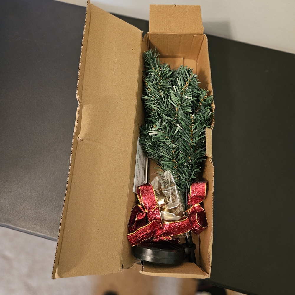 Festive Green Holiday Tree with Red Ribbon